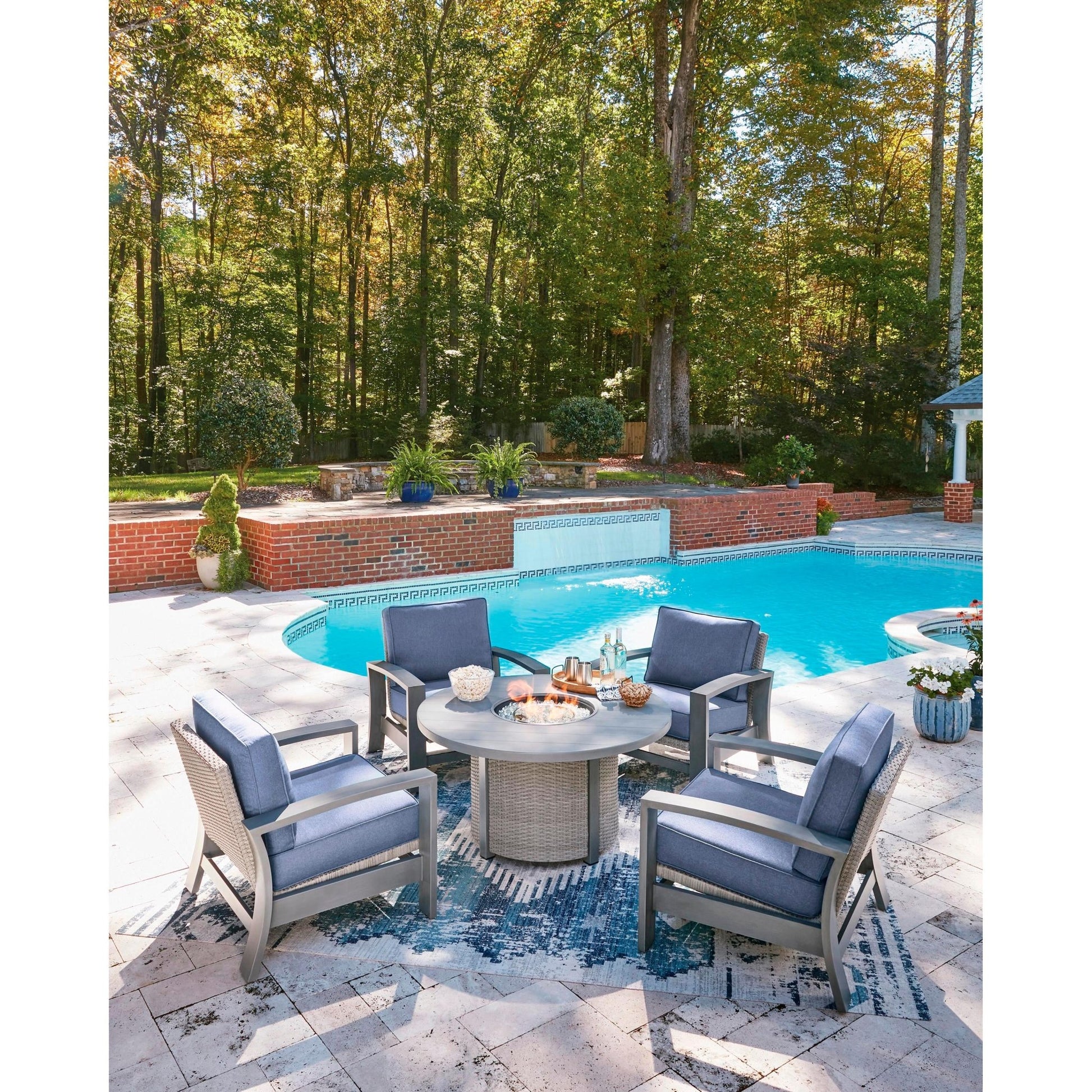 Signature Design by Ashley Half Moon Beach PCP418 - 776 Round Fire Pit Table - American Furniture of Slidell