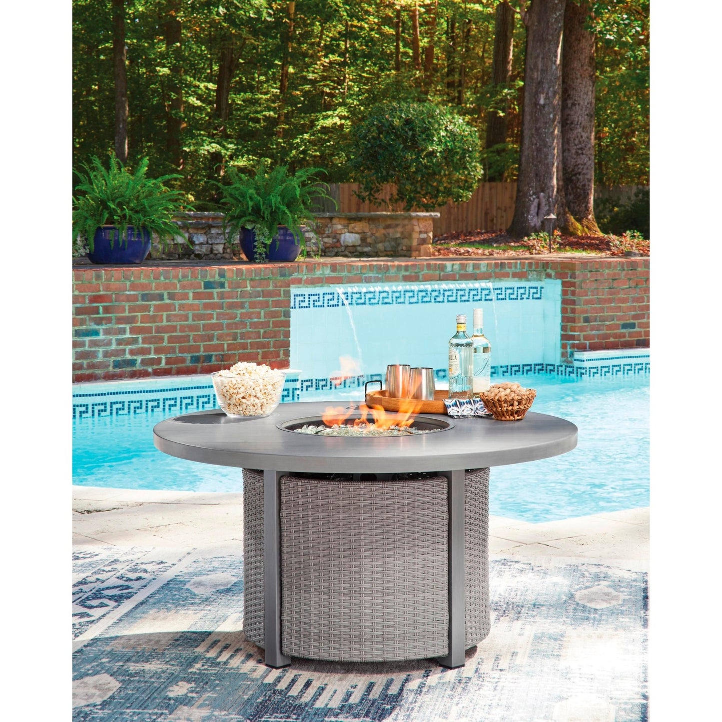 Signature Design by Ashley Half Moon Beach PCP418 - 776 Round Fire Pit Table - American Furniture of Slidell