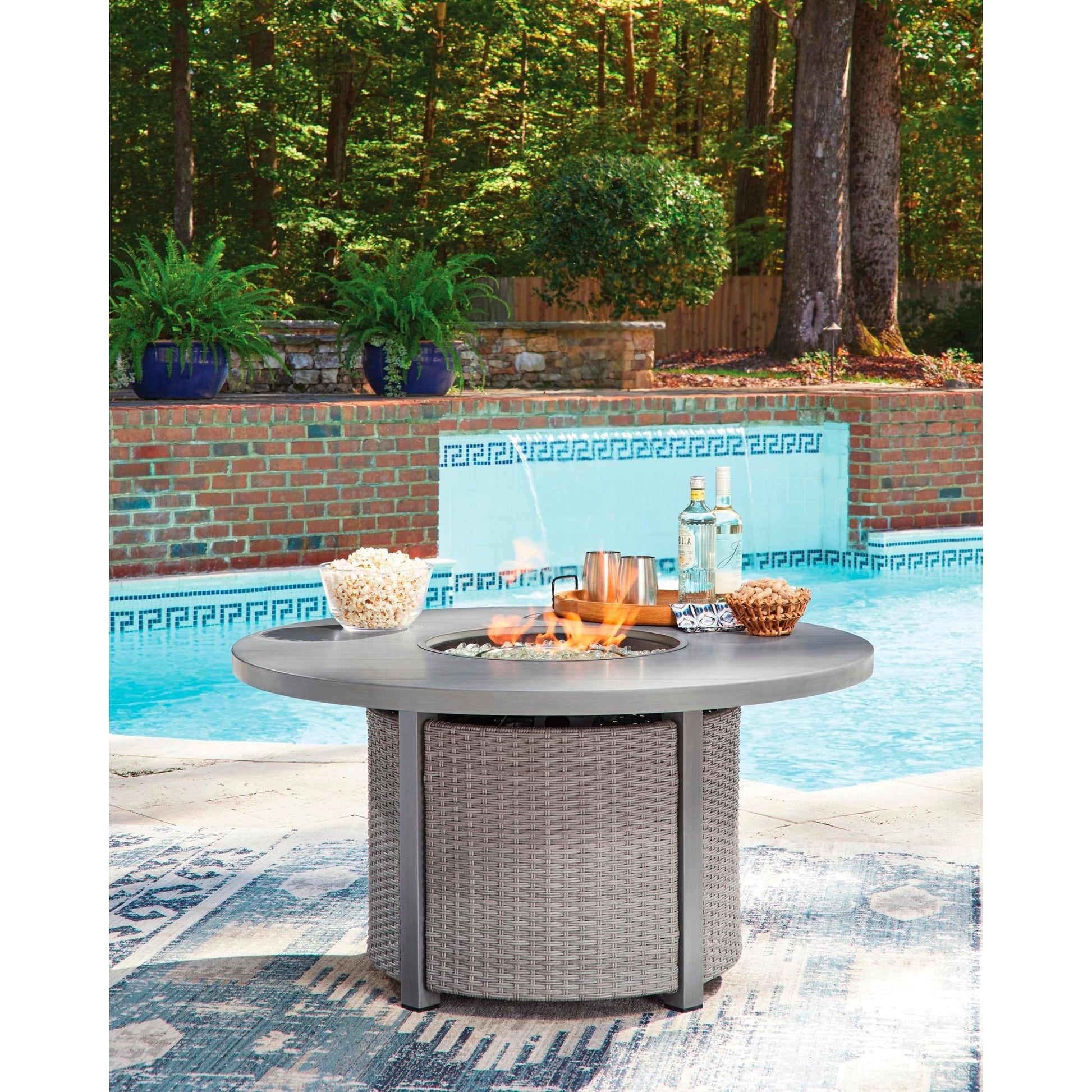 Signature Design by Ashley Half Moon Beach PCP418 - 776 Round Fire Pit Table - American Furniture of Slidell
