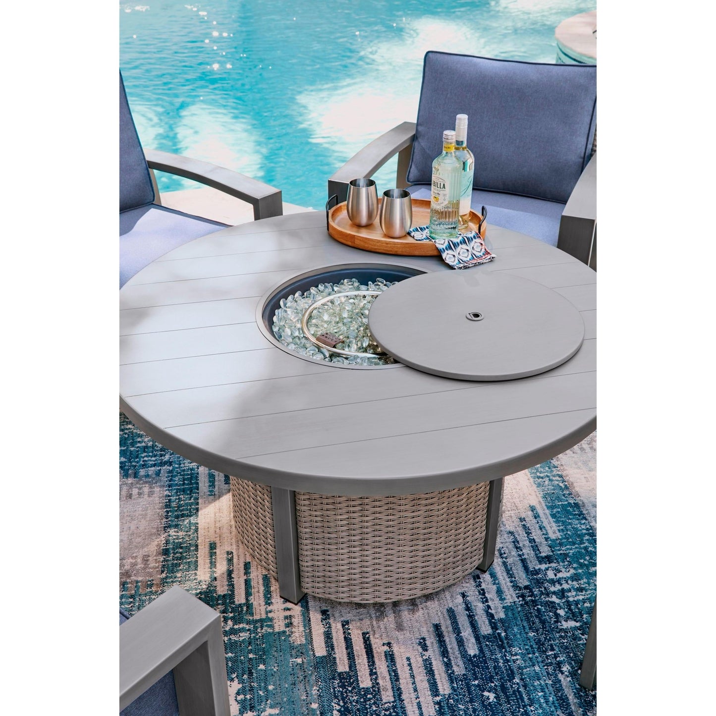 Signature Design by Ashley Half Moon Beach PCP418 - 776 Round Fire Pit Table - American Furniture of Slidell