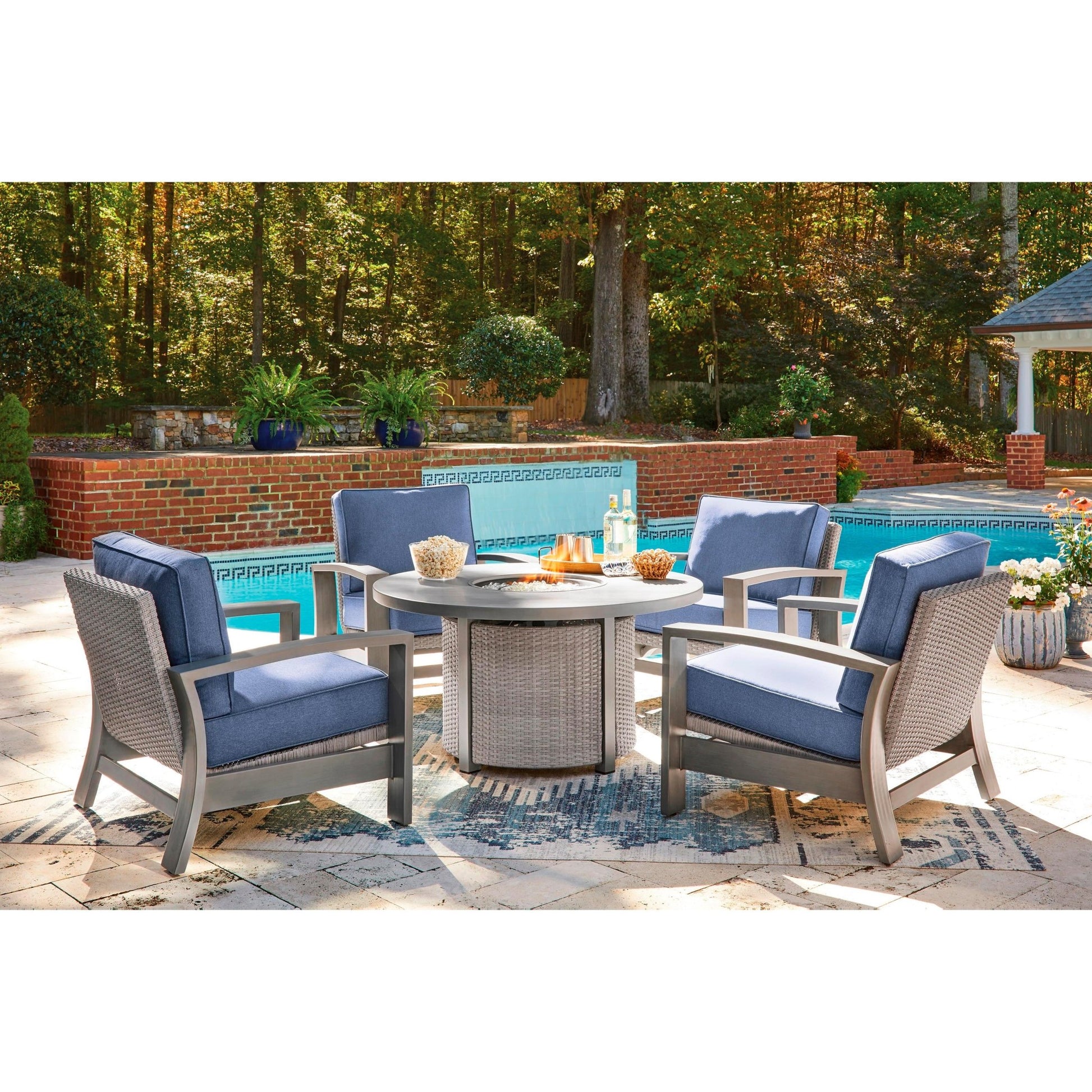 Signature Design by Ashley Half Moon Beach PCP418 - 776 Round Fire Pit Table - American Furniture of Slidell