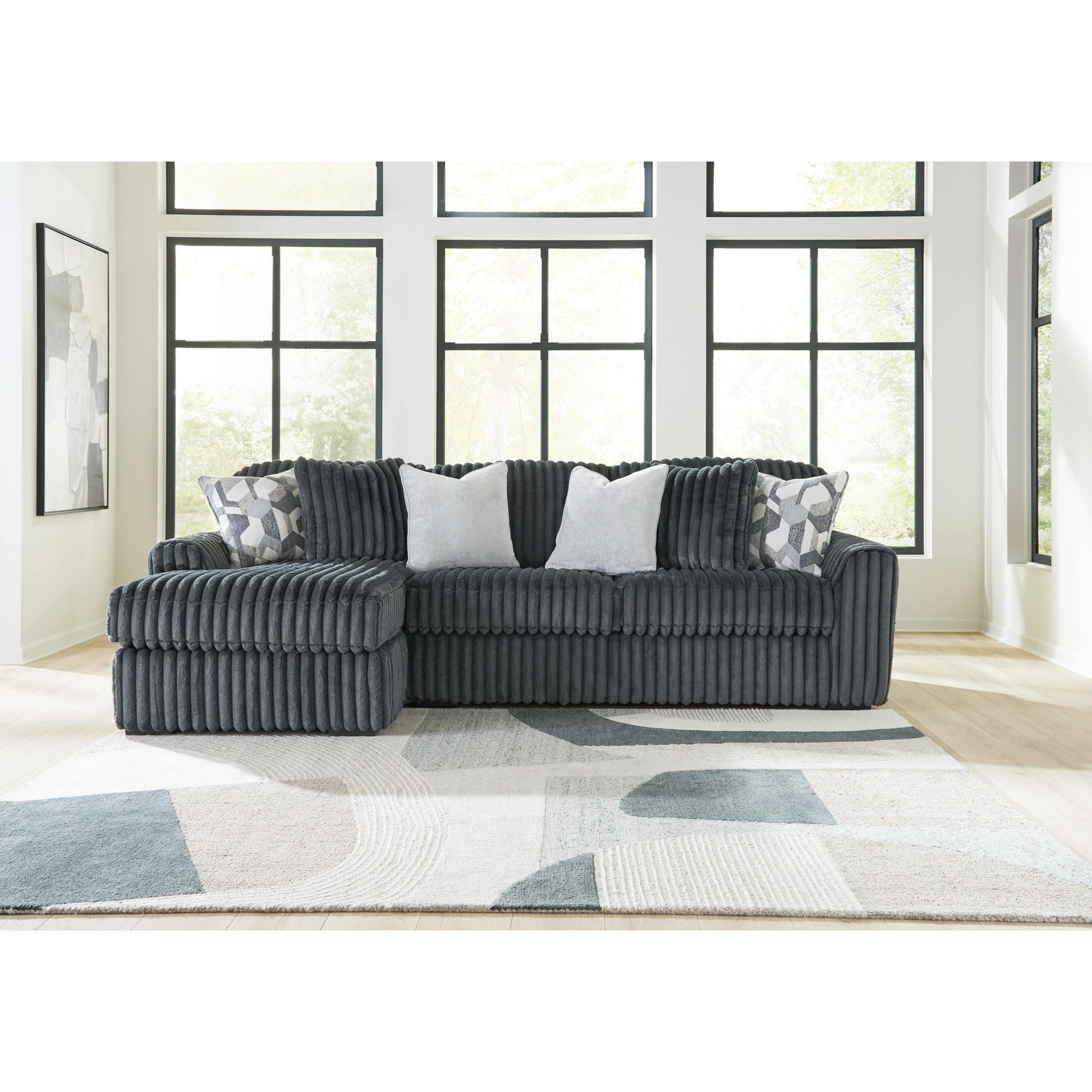 Signature Design by Ashley Midnight - Madness 98105S4 2 pc Sectional Sofa Chaise - American Furniture of Slidell