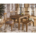 Ashley Furniture dining room chairs and wooden table set with bench in rustic dining room